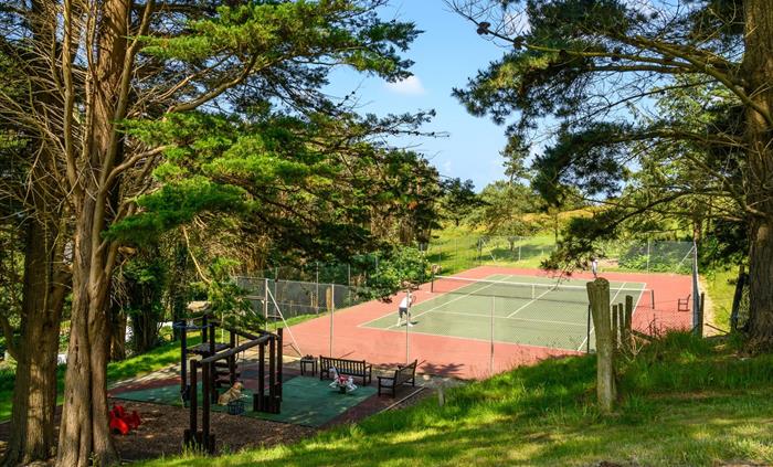 Hotel tennis court and play area